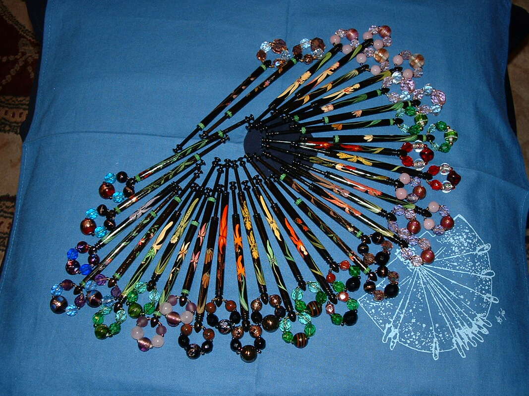 My Sarah Jones' Orchid bobbins, bought one bobbin a month from the early 1990s