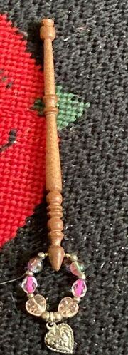 DJ Hornsby 'plastic' bobbin in brown. Note that the number of 'balls' at the end by the spangle may vary from bobbin to bobbin. photo ©the lace bee