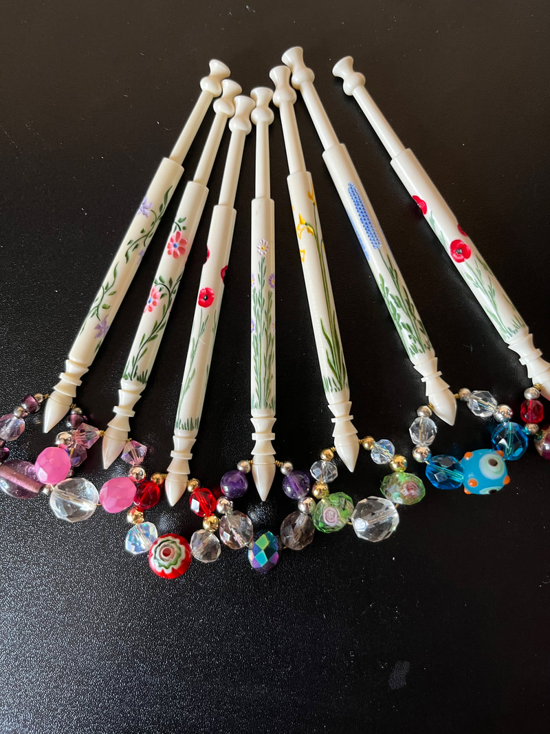 Archer engraved and painted bone bobbins photo ©the lace bee